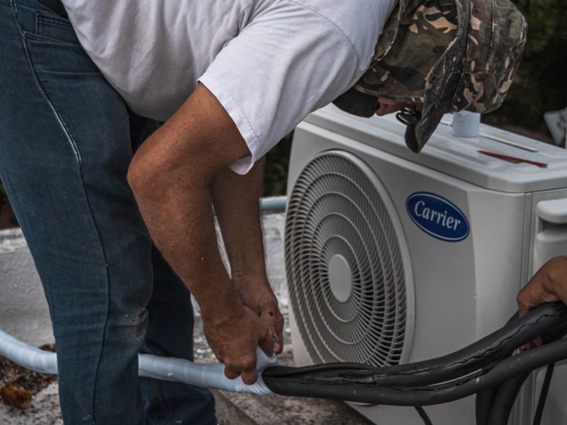 An air conditioning unit being serviced